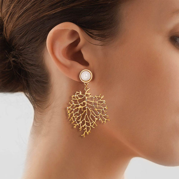 Women wearing a gold Sea Fan Coral Earring