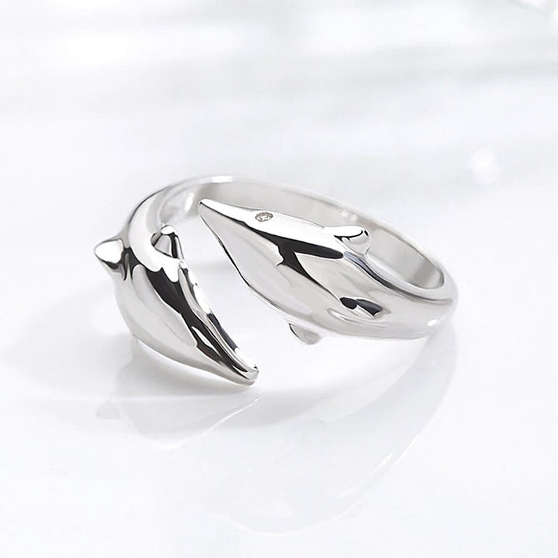 Dolphin ring in sterling silver on tabletop 