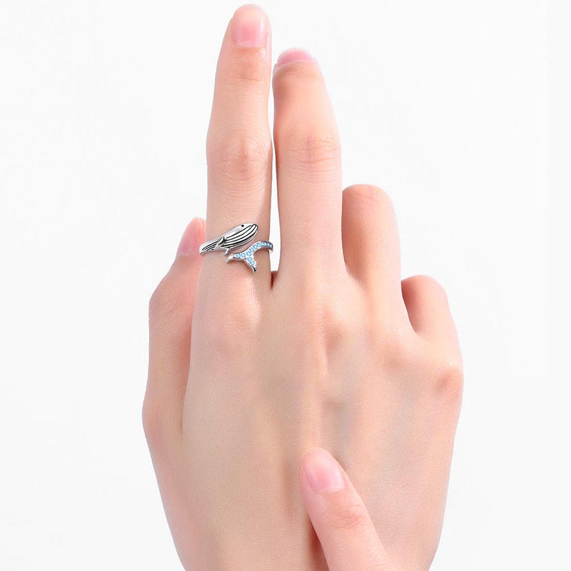 Blue Whale Ring on women's index finger