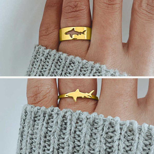 Two hands wearing gold Couples Shark Rings set
