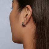 Model wearing a Dolphin Hoop Earring