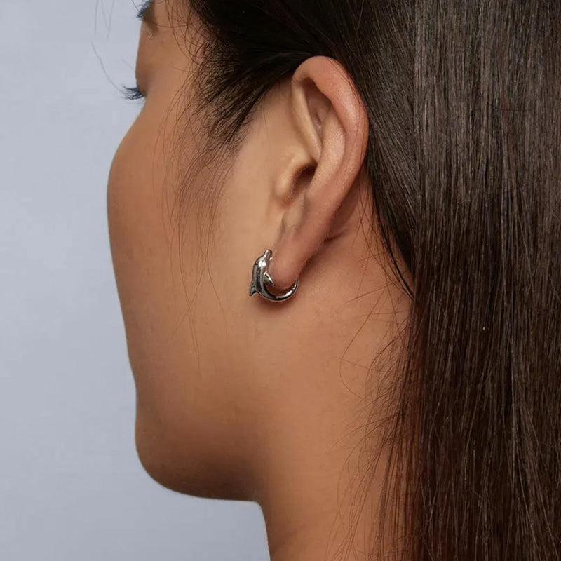 Model wearing a Dolphin Hoop Earring
