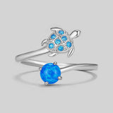Blue crystals and opal on sterling silver open ring