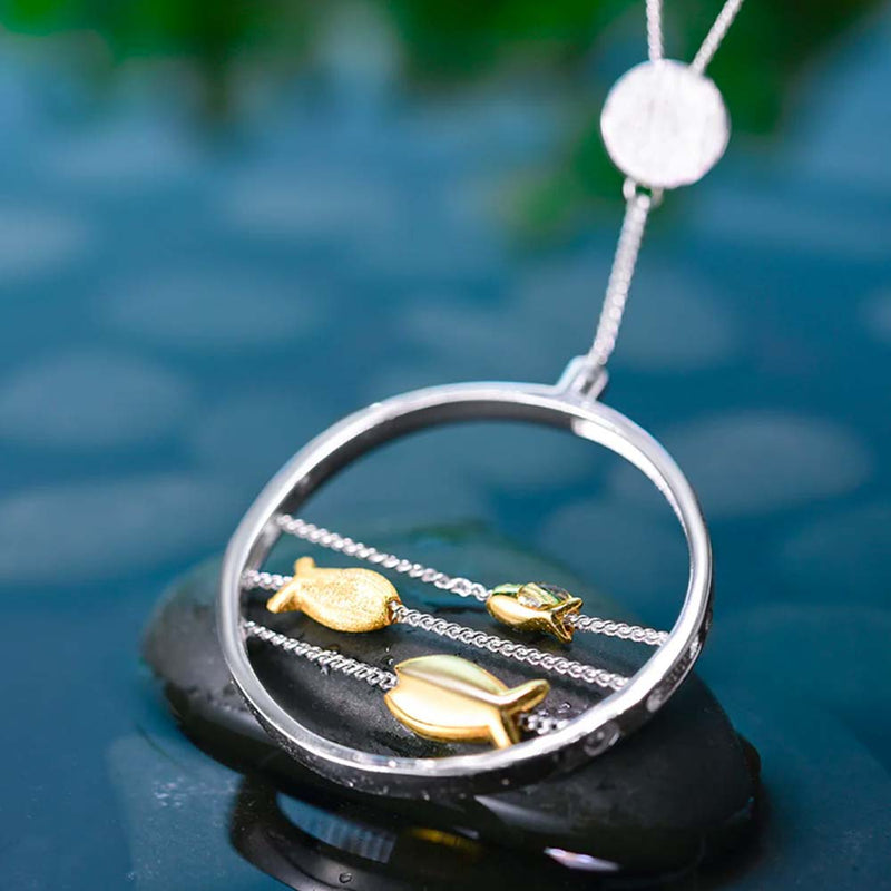 Sliding fish  pendant close up on water