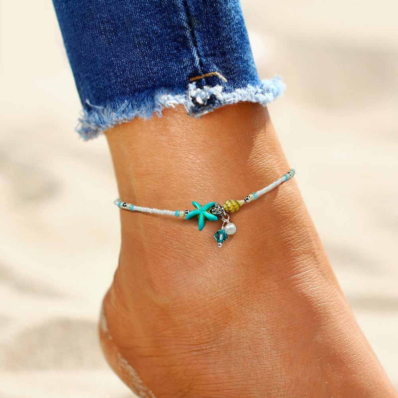 Woman wearing a Turquoise Starfish Anklet with Shell Charms 