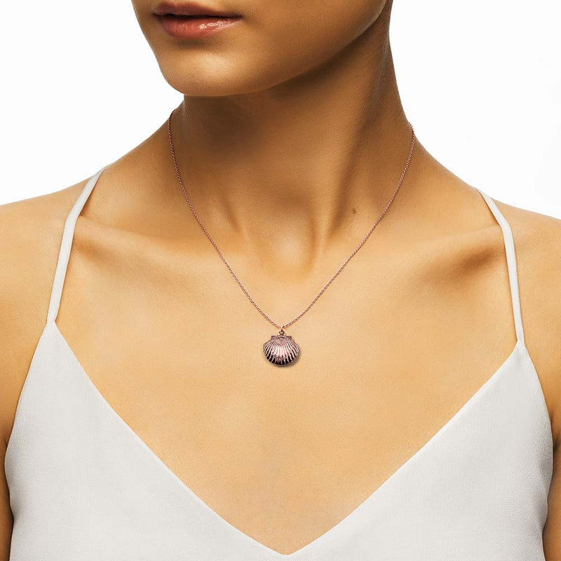Rose Gold Shell Necklace on woman’s neck 