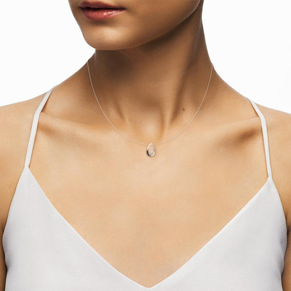 Female model wearing a floating Glass pendant necklace