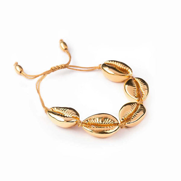 Gold seashell bracelet on cord 