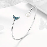 Silver Mermaid Bracelet on white table
