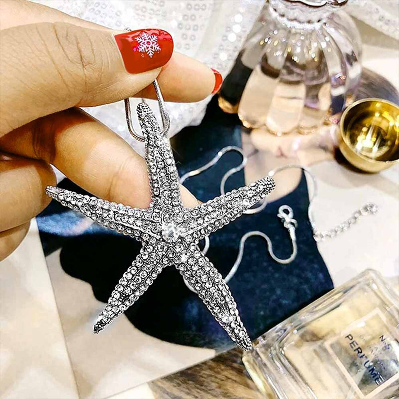 Hand holding a Crystal Starfish Pendant