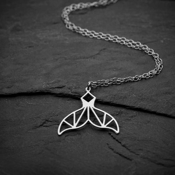 Laser Cut Fishtail Necklace on black background 