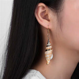 woman wearing a smooth Gold Conch Earring