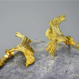 Detail of gold siamese fighting fish earrings