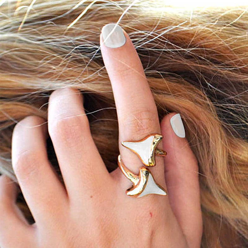 Woman wearing a double shark tooth ring on her index finger
