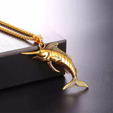 Gold Marlin Necklace on table top
