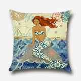 Mermaid resting on a rock cushion cover