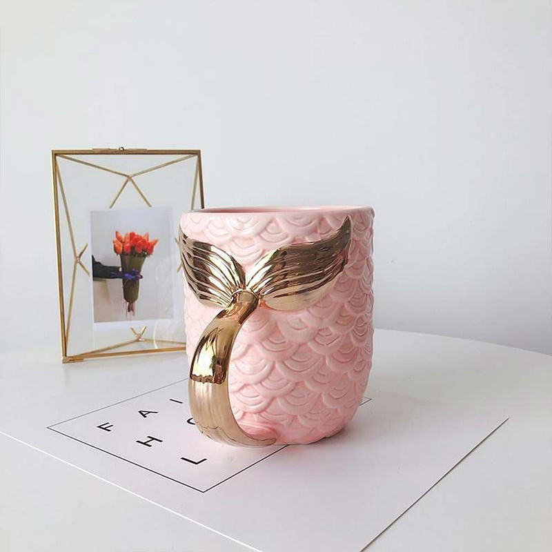 Pink Ceramic Mermaid Mug on table