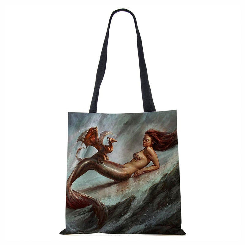Mermaid and baby dragon tote bag