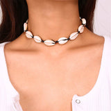 Woman wearing a Black Cowrie Shell Choker 