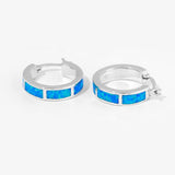 Ocean blue hoop earrings lying flat 