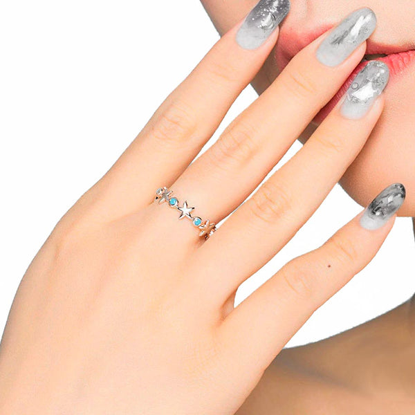 Woman wearing Aqua Blue Starfish Ring on index finger