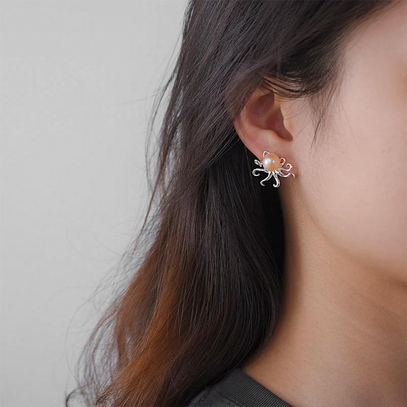 Woman model wearing a Silver Octopus Stud Earring with pearl