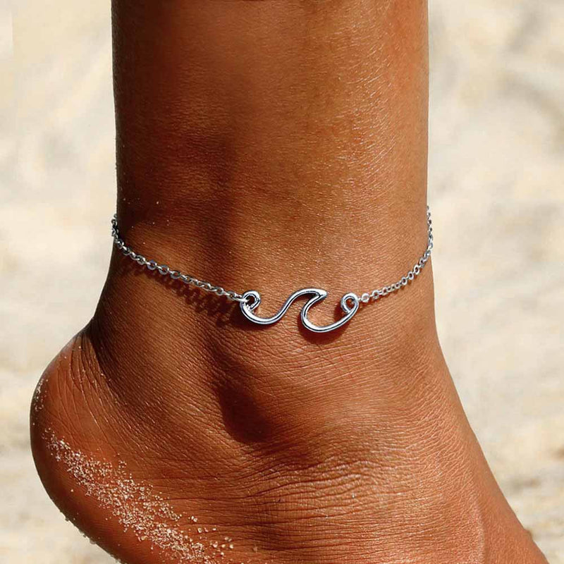 Woman wearing a simple Wave Anklet in Silver 