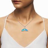Modal wearing a mermaid pendant necklace