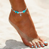Model wearing a Blue Beaded Starfish Anklet on the beach 